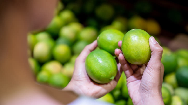 Person shopping for limes