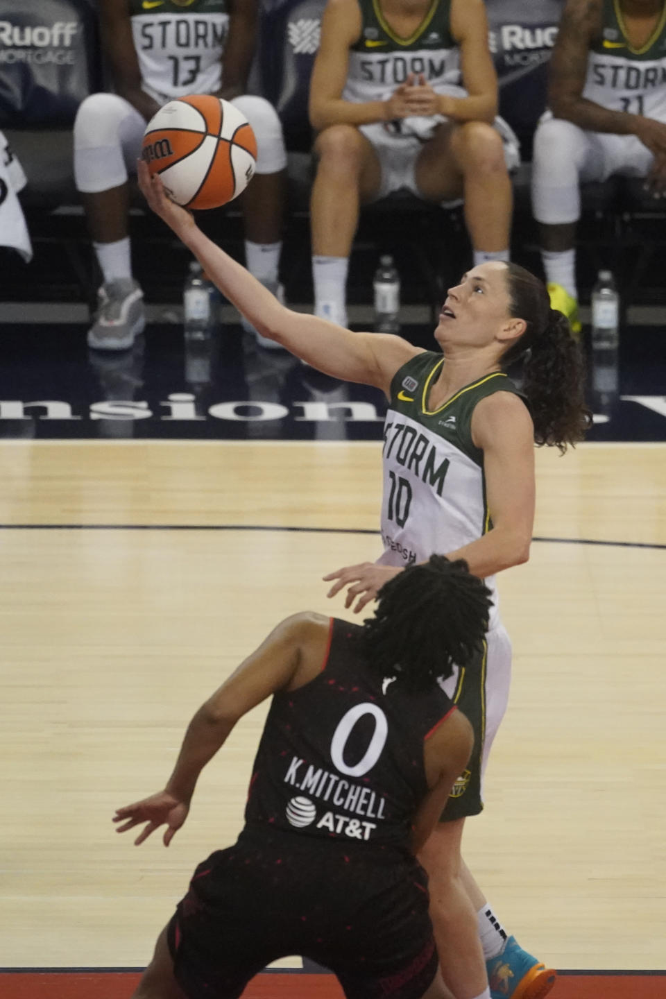 Seattle Storm's Sue Bird puts shoots against Indiana Fever's Kelsey Mitchell during the second half of a WNBA basketball game Thursday, June 17, 2021, in Indianapolis. (AP Photo/Darron Cummings)