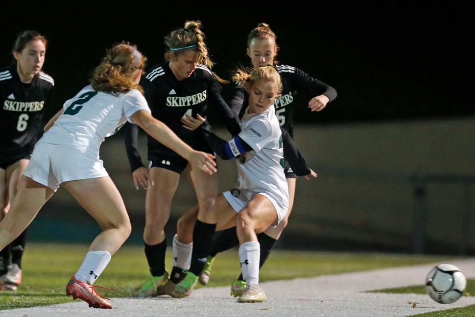 Madison O'Connor, of North Kingstown battles Chariho's Tessa Azzinaro in a game last season.