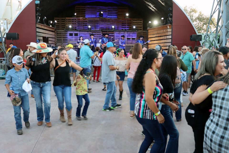 People have fun dancing to the band Control during the 2021 Fajita Festival hosted by the Amarillo Hispanic Chamber of Commerce at the Starlight Ranch Event Center Friday evening.