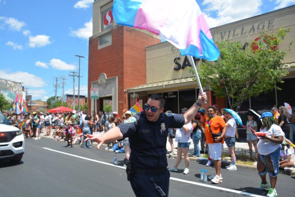 The Baltimore Police Department marched during the Pride parade on Saturday. The event ended when the crowd went into a panic when Mace was sprayed during a fight and fireworks filled the sky. (Baltimore Police Department)