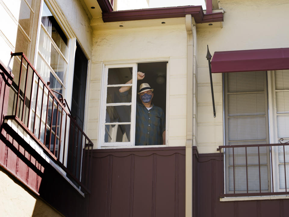 Nathan Long, a video game writer, stands inside his rental apartment in Glendale, Calif., Thursday, April 8, 2021. He and his wife, Lili, have been unsuccessful so far in their search for a home in Los Angeles. (AP Photo/Damian Dovarganes)