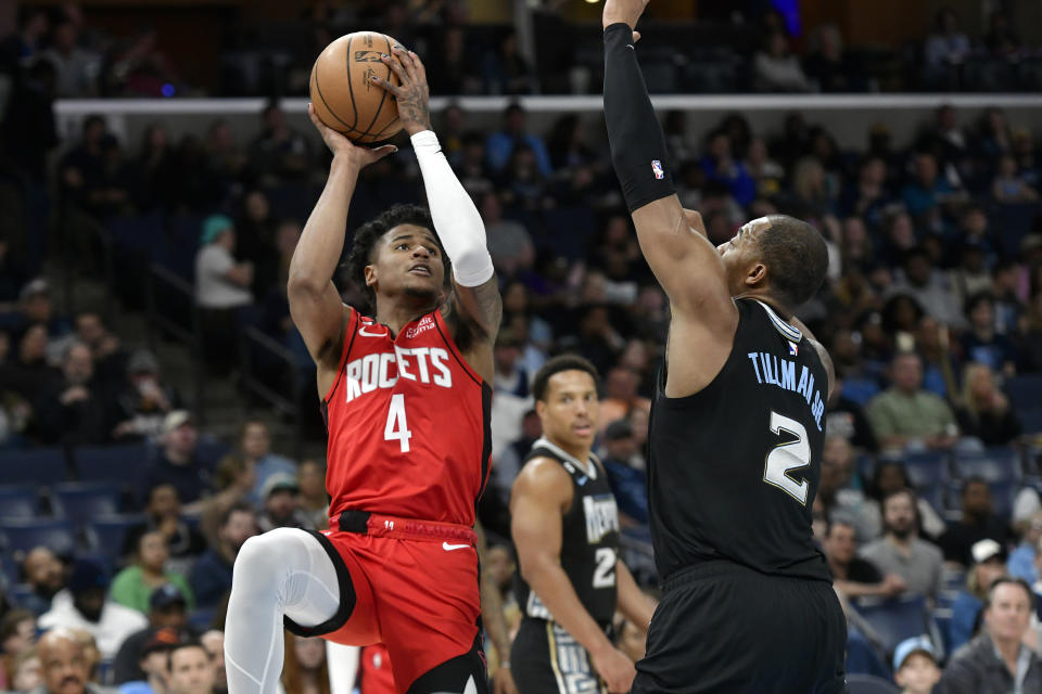 Houston Rockets guard Jalen Green (4) shoots against Memphis Grizzlies forward Xavier Tillman (2) in the first half of an NBA basketball game Friday, March 24, 2023, in Memphis, Tenn. (AP Photo/Brandon Dill)