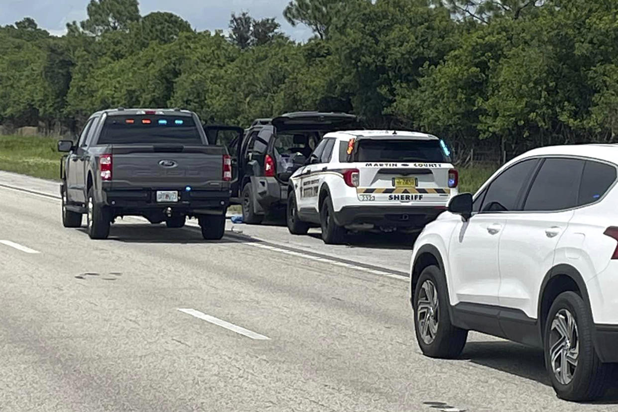 Sheriff's vehicles surround an SUV on I-95 in Martin County Fla. 