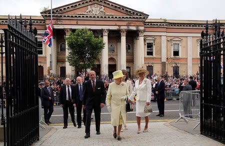 Britain's Queen Elizabeth and Prince Philip (front, L) arrive for a tour of Crumlin Road Gaol in Belfast, Northern Ireland June 24, 2014. REUTERS/Paul Faith/Pool