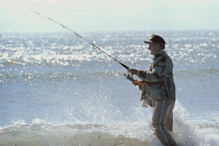 <p>President George Bush casts into the surf at the mouth of the Mousam River in Kennebunk, Maine, on Sept. 25, 1989. (Photo: Doug Mills/AP) </p>