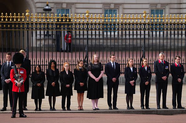 LONDON, ENGLAND - SEPTEMBER 19: Buckingham Palace household staff pay their respects during the State Funeral of Queen Elizabeth II on September 19, 2022 in London, England. Elizabeth Alexandra Mary Windsor was born in Bruton Street, Mayfair, London on 21 April 1926. She married Prince Philip in 1947 and ascended the throne of the United Kingdom and Commonwealth on 6 February 1952 after the death of her Father, King George VI. Queen Elizabeth II died at Balmoral Castle in Scotland on September 8, 2022, and is succeeded by her eldest son, King Charles III.  (Photo by Carl Court/Getty Images)