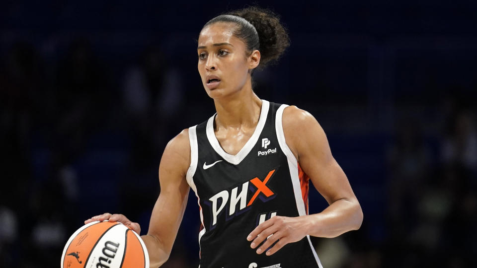 Phoenix Mercury guard Skylar Diggins-Smith controls the ball during a WNBA basketball game against the Dallas Wings, Saturday, June 18, 2022, in Arlington, Texas. (AP Photo/Tony Gutierrez)