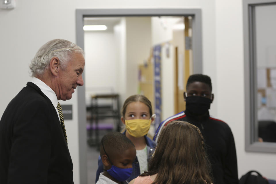 Camden Elementary School students in masks listen as South Carolina Gov. Henry McMaster talks to them on Wednesday, Sept. 15, 2021, in Camden, S.C. McMaster has adamantly and repeatedly come out against requiring face masks in schools even as the average number of daily COVID-19 cases in the state has risen since early June. AP Photo/Jeffrey Collins)