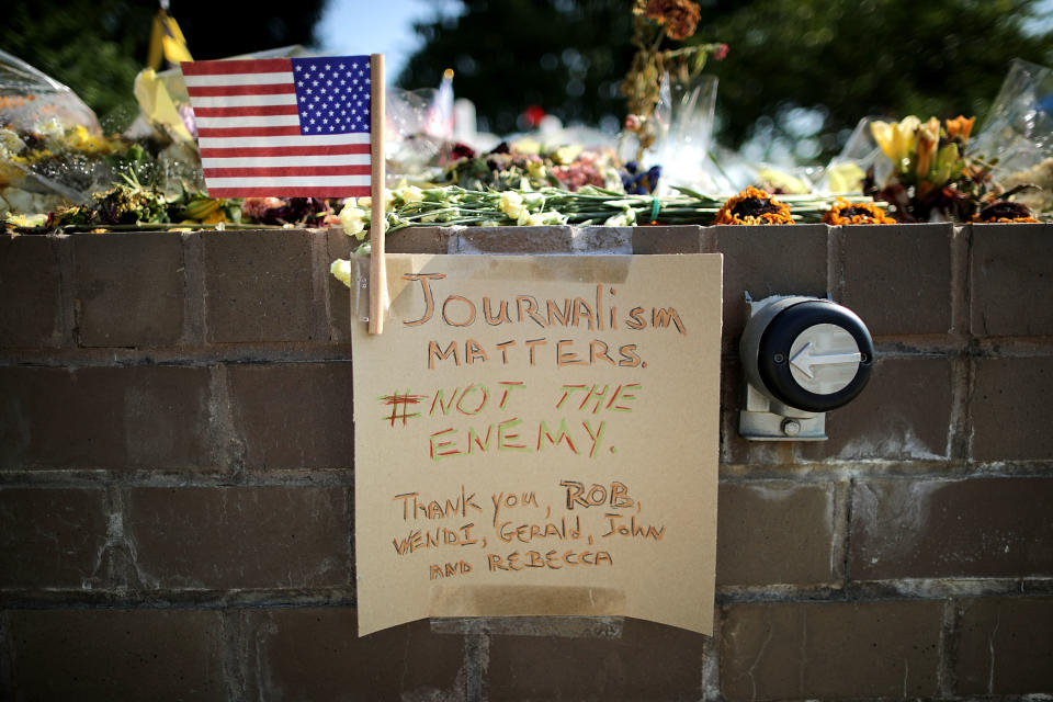 Flowers and handwritten notes and signs are seen at a makeshift memorial on July 2, 2018, outside the Capitol Gazette offices for the five employees killed by a gunman in Annapolis, Md. (Photo: Chip Somodevilla/Getty Images)