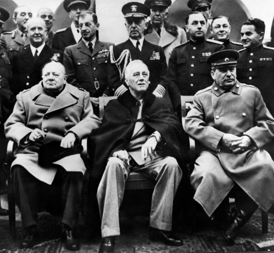 British Prime minister Winston Churchill (L), US president Franklin Delano Roosevelt (C) and USSR Secretary general of the Soviet Communist Party (PCUS), Joseph Stalin (R) pose at the start of the Conference of the Allied powers in Yalta, Crimea, on February 4, 1945 at the end of World War II. During the Yalta Conference, which took place from February 4 to 11, 1945, "The Big Three" (Stalin, Roosevelt, Churchill) decided the demilitarization and denazification of Germany and carved out their own post-war zones of influence across the globe.