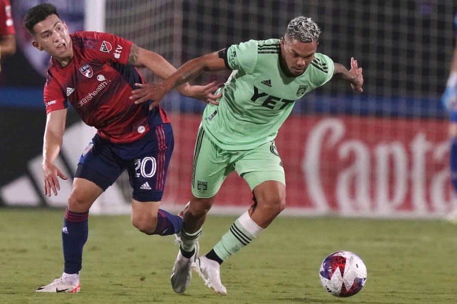 Austin FC midfielder Daniel Pereira chases the ball next to FC Dallas forward Alan Velasco (20) during the first half of an MLS soccer match Saturday, Aug. 26, 2023, in Frisco, Texas. (AP Photo/LM Otero)