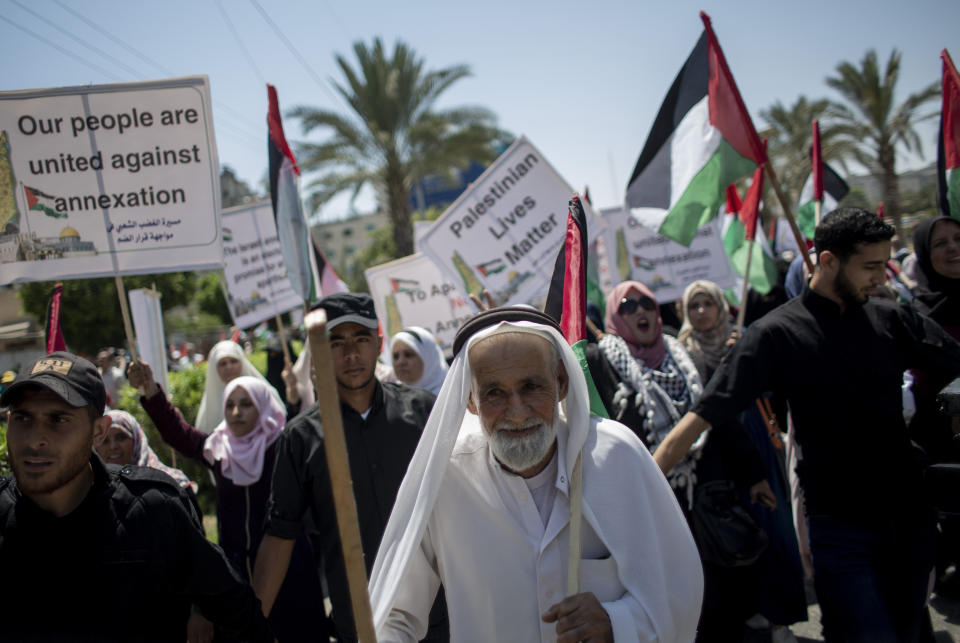 Palestinians demonstrate against Israeli plans for the annexation of parts of the West Bank, in Gaza City, Wednesday, July 1, 2020. (AP Photo/Khalil Hamra)