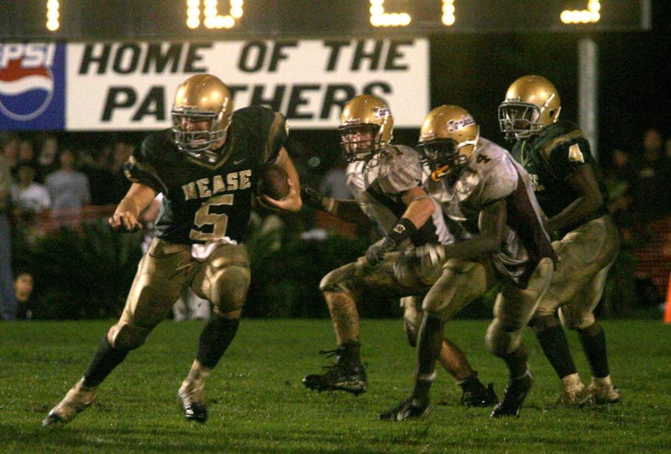 Tim Tebow rushes for Nease against St. Augustine in 2005. The St. Johns County rivals have met every season since 1987. This year, another University of Florida-committed quarterback, Marcus Stokes, leads Nease against St. Augustine.