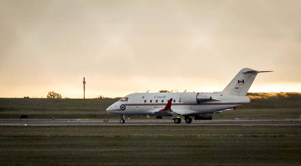 A Canadian Forces Challenger jet takes off from the Calgary International Airport in Calgary after two Canadians who were imprisoned in China for nearly three years returned, , Saturday, Sept. 25, 2021. Video from CTV shows Prime Minister Justin Trudeau greeting Michael Kovrig and Michael Spavor on the tarmac at the airport in Calgary early this morning. (Jeff McIntosh/The Canadian Press via AP)