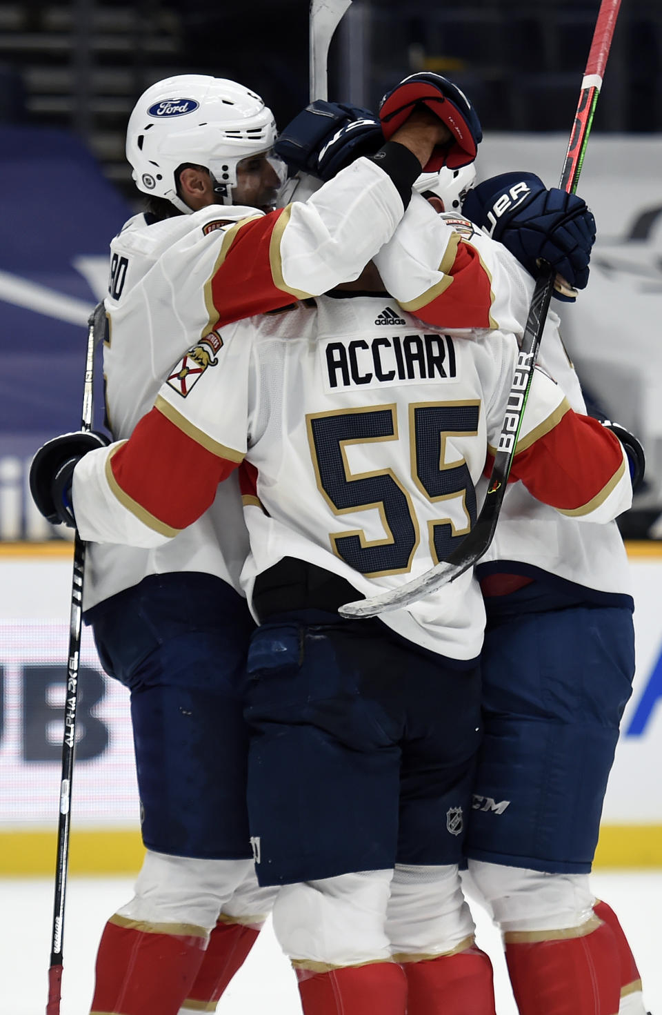 Florida Panthers center Noel Acciari (55) celebrates with teammates after his third goal for a hat trick against the Nashville Predators during the third period of an NHL hockey game Saturday, March 6, 2021, in Nashville, Tenn. (AP Photo/Mark Zaleski)