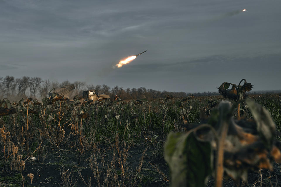 Ukrainian military's Grad multiple rocket launcher fires rockets at Russian positions in the frontline near Bakhmut, Donetsk region, Ukraine, Thursday, Nov. 24, 2022. (AP Photo/LIBKOS)