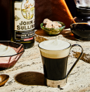 <p><em>A mug of Irish Coffee is hot enough to soothe your tumultuous stomach, but caffeinated enough to give you that necessary second-wind buzz. </em></p><p><strong>Ingredients</strong><br>• 2 oz. Irish whiskey<br>• 5 oz. hot coffee<br>• 2 tsp. sugar<br>• heavy cream</p><p><strong>Directions</strong><br>Pour the whiskey, coffee, and sugar into a stemmed, heated glass mug. Stir, then top off with a thick layer of lightly whipped heavy cream.</p><p><a class="link " href="https://www.esquire.com/food-drink/drinks/recipes/a3808/irish-coffee-drink-recipe/" rel="nofollow noopener" target="_blank" data-ylk="slk:Read More;elm:context_link;itc:0;sec:content-canvas">Read More</a></p>