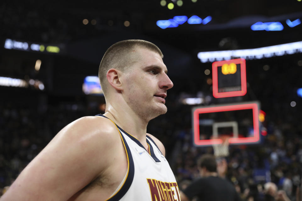 Denver Nuggets center Nikola Jokic walks off the court after the team's loss in Game 5 of an NBA basketball first-round playoff series against the Golden State Warriors in San Francisco, Wednesday, April 27, 2022. The Warriors won the series. (AP Photo/Jed Jacobsohn)