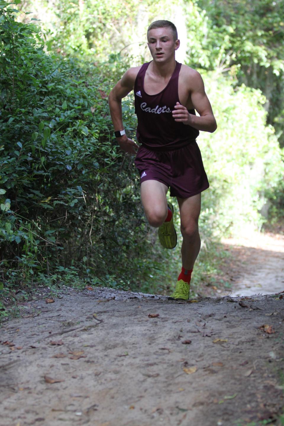 Benedictine's John Dodson, then a freshman, runs up a hill during the Class 3-4A region meet in 2021. Now a sophomore, Dodson is one of the top returning runners in the Greater Savannah area.