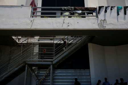 People are seen at the premises of the disused Hellenikon airport, where refugees and migrants are temporarily housed, in Athens, Greece, July 13, 2016. Picture taken July 13, 2016. REUTERS/Alkis Konstantinidis