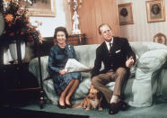 BALMORAL;SCOTLAND - 1975: Queen Elizabeth ll and Prince Phillip the Duke of Edinburgh relaxing with their corgis and newspapers at Balmoral in 1975. (Photo by Anwar Hussein/Getty Images)