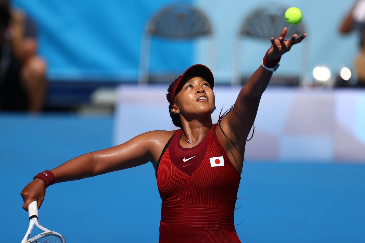 Naomi Osaka serves during Sunday’s first-round match against Zheng Saisai of China (Reuters)