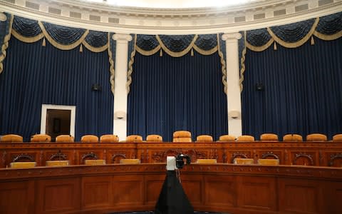 The dais in the hearing room where the House will begin public impeachment inquiry hearings  - Credit: AP