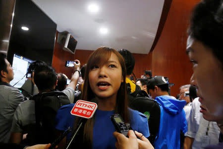 Legislator-elect Yau Wai-ching speaks to reporters outside the chamber after pro-Beijing lawmakers staged a walk-out to stall her swearing-in at the Legislative Council in Hong Kong, China October 19, 2016. REUTERS/Bobby Yip