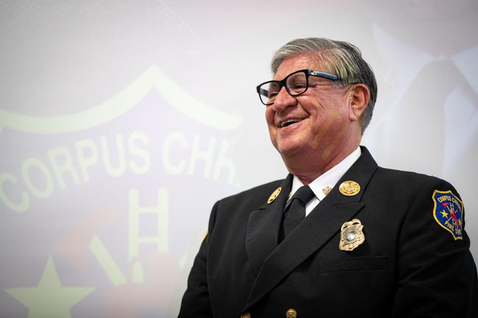 Corpus Christi Fire Chief Robert Rocha smiles after being recognized by state Sen. Juan "Chuy" Hinojosa during Rocha's retirement ceremony on Friday, Jan. 20, 2023, in Texas.