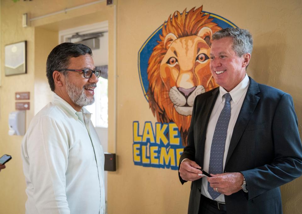 Lake Park Elementary School Principal Carlos Castro gives Palm Beach Couny School Superintendent Mike Burke a tour of the school in August.