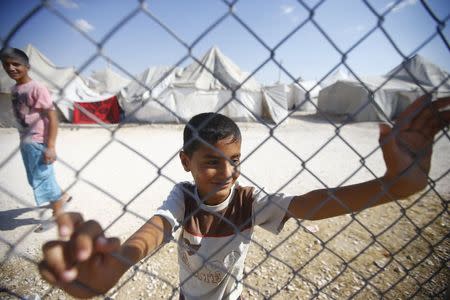 Syrian refugee children play at Suleymansah refugee camp in Akcakale in Sanliurfa province, Turkey, June 11, 2015. REUTERS/Osman Orsal