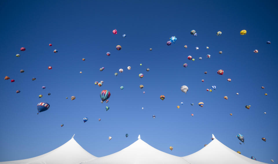 Balloons begin to take off during the Albuquerque International Balloon Fiesta Saturday, Oct. 7, 2023 in Albuquerque, N.M. (AP Photo/Roberto E. Rosales)
