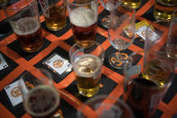 <p>Half finished glasses are placed on squares in return for tickets by visitors leaving the building to smoke cigarettes at the CAMRA (Campaign for Real Ale) Great British Beer festival at Olympia exhibitioncenter on August 8, 2017 in London, England. (Photo: Carl Court/Getty Images) </p>