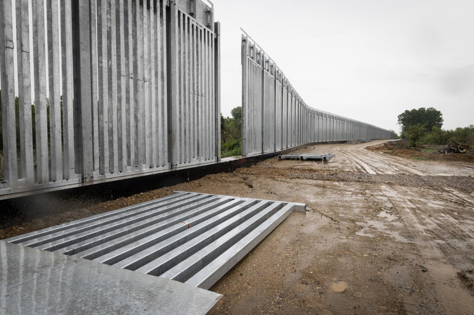 A view of a steel wall at Evros river, near the village of Poros, at the Greek-Turkish border, Greece, Friday, May 21, 2021. An automated hi-tech surveillance network being built on the Greek-Turkish border aiming at detecting migrants early and deterring them from crossing, with river and land patrols using searchlights and long-range acoustic devices. (AP Photo/Giannis Papanikos)