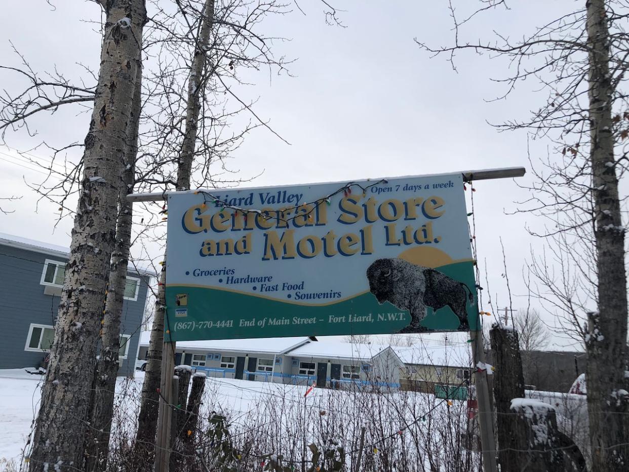 The sign for the Fort Liard General Store and Motel.  (Luke Carroll/CBC - image credit)