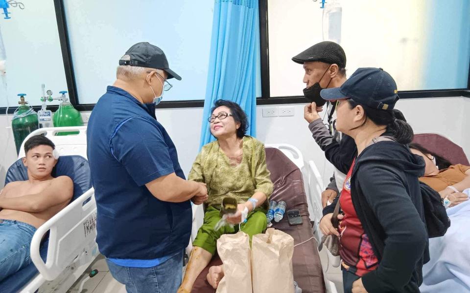 Lanao Del Sur provincial governor Mamintal Adiong Jr visits the injured at a hospital following the Mass explosion