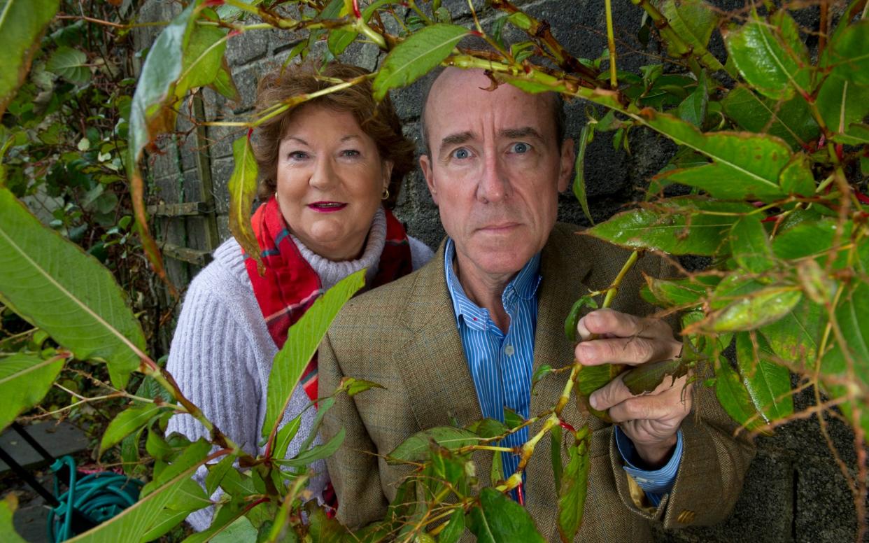 Paul and Teresa Hunter with the Himalayan Knotweed in their Cornish garden