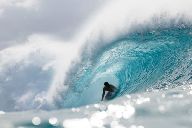 <em>The early afternoon light at Pipeline sparkles with bright blues as Josh Moniz searches for the exit.</em><p>Ryan "Chachi" Craig</p>