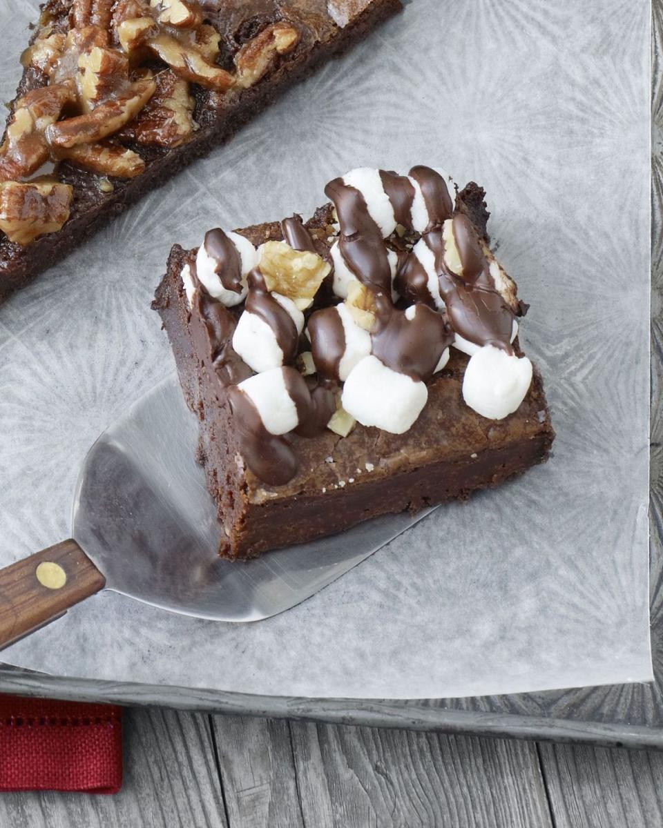 <p>These brownies are next level delicious! Classic walnut brownies full of texture, creamy chocolate fudge, and fluffy mini marshmallows take this treat over the top.</p><p><strong><a href="https://www.countryliving.com/food-drinks/recipes/a3535/rocky-road-brownies-recipe-clv1210/" rel="nofollow noopener" target="_blank" data-ylk="slk:Get the recipe for Rocky Road Brownies" class="link ">Get the recipe for Rocky Road Brownies</a>.</strong></p>