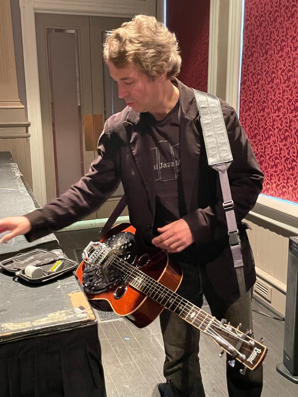 Blues guitarist James Limerick Kerr gets ready to play his dobro.