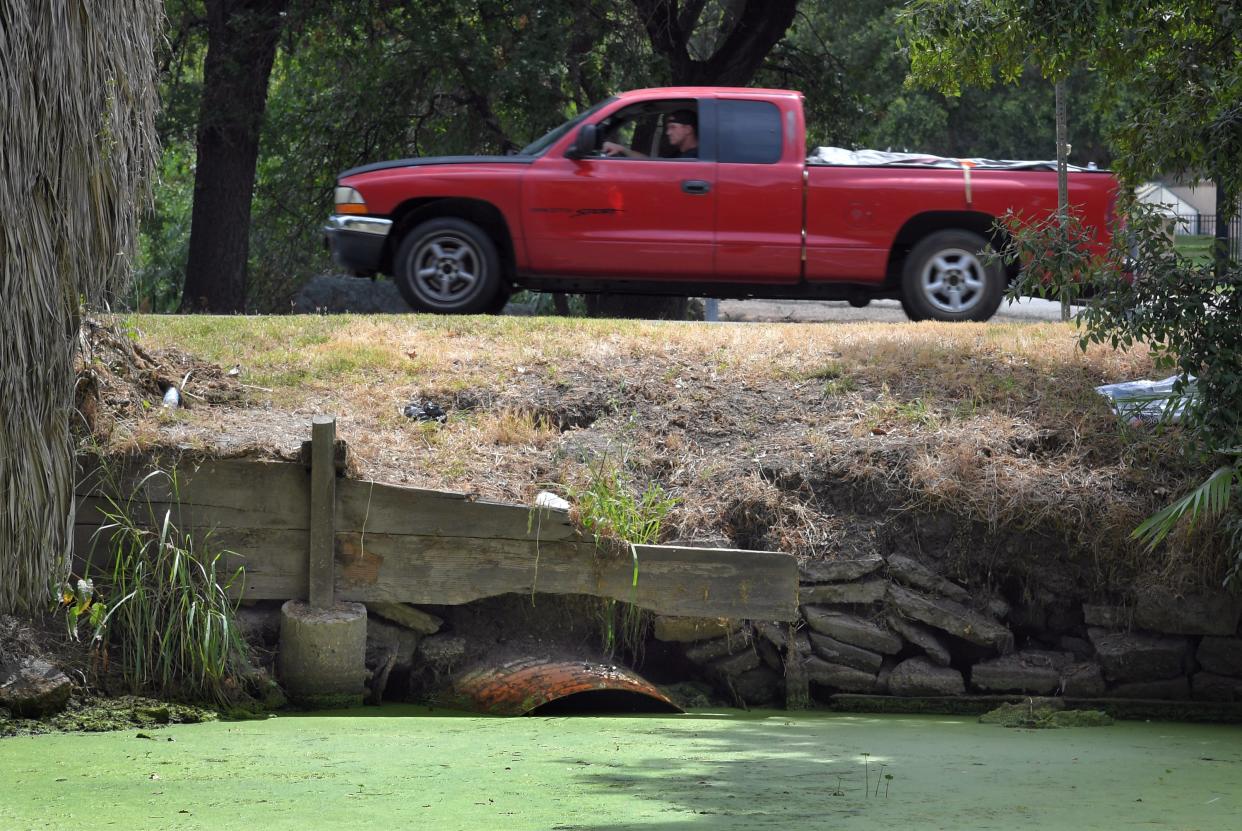 A culvert under Alexandria Place is mostly blocked at Five Mile Slough and Lincoln Road June 7, 2017, in Stockton.