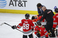 Chicago Blackhawks center Jujhar Khaira (16) leaves the ice on a stretcher after being knocked out by New York Rangers defenseman Jacob Trouba during the second period of an NHL hockey game, Tuesday, Dec. 7, 2021, in Chicago. (AP Photo/Kamil Krzaczynski)