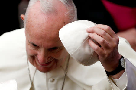 Pope Francis adjusts his cap as he leads the audience for Slovakia’s pilgrims at the Paul VI Hall in Vatican, October 6, 2018. REUTERS/Alessandro Bianchi