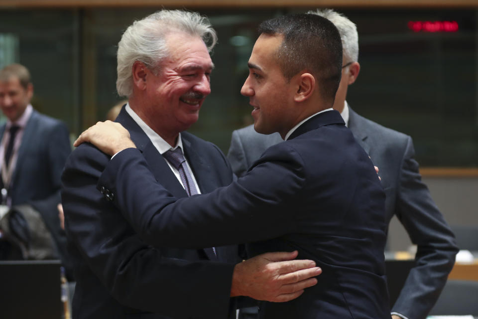 Italian Foreign Minister Luigi Di Maio, right, greets his Luxembourg counterpart Jean Asselborn an European Foreign Affairs Ministers meeting at the Europa building in Brussels, Monday, Nov. 11, 2019. European Union foreign ministers on Monday debated ways to keep the Iran nuclear deal intact after the Islamic Republic began enrichment work at its Fordo site in a fresh act of defiance that seems likely to spell the end of the painstakingly drafted international agreement. (AP Photo/Francisco Seco)