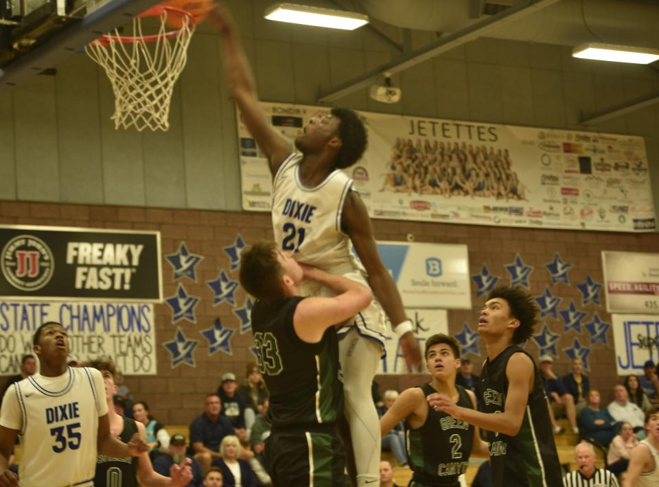 Dixie's Cam Dyer rocks the rim during the first quarter of the Flyers' 71-60 win over Green Canyon on Friday.