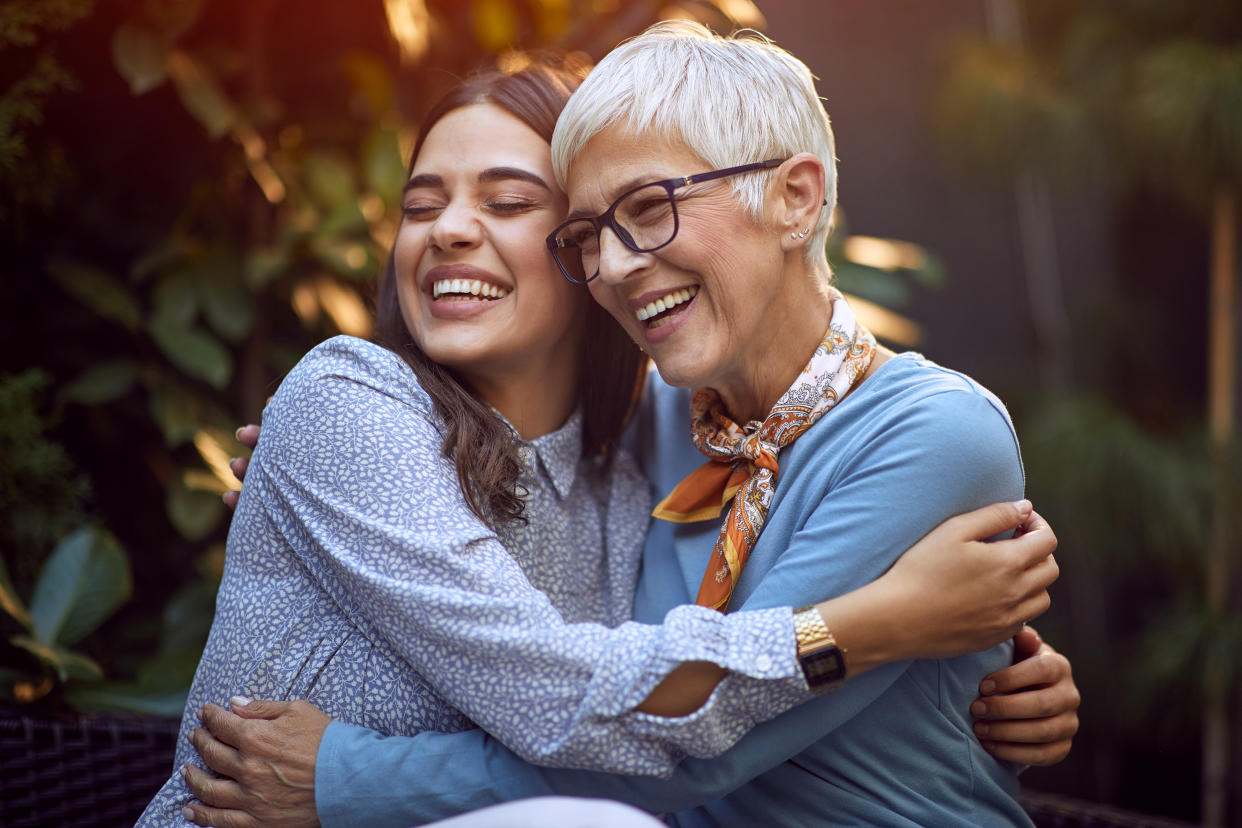 Happy daughter embracing her smiling mother. balance hormones