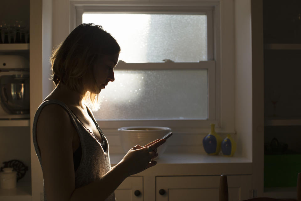 A woman is on her cellphone