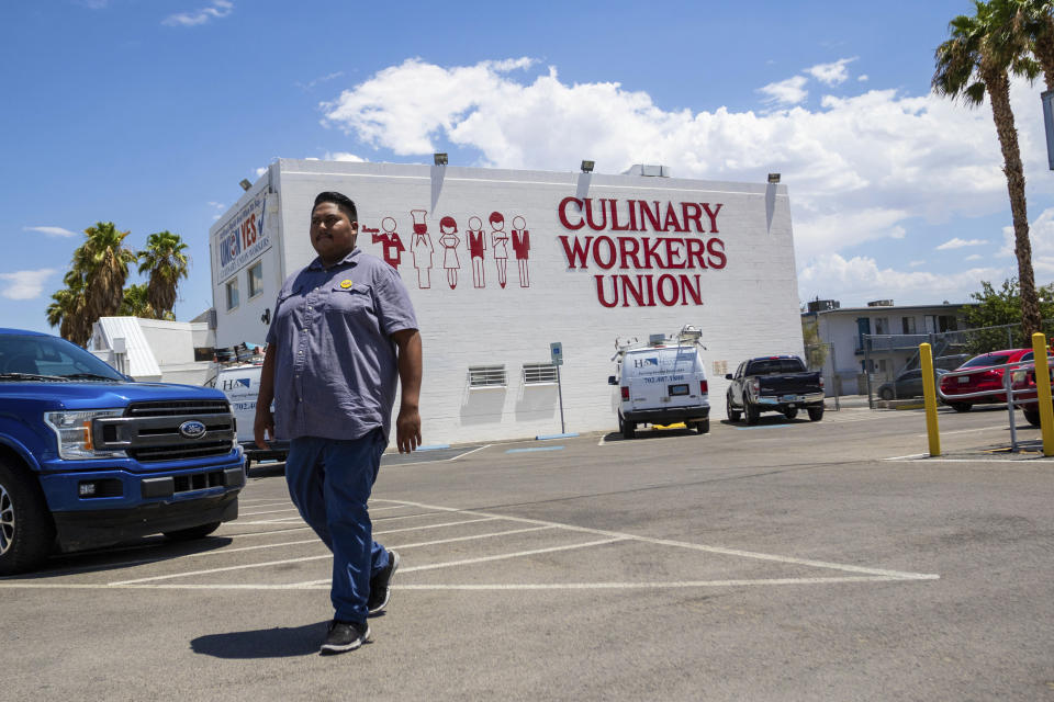 Alberto Rodriguez, 24, walks to his car outside the Culinary Union on Wednesday, July 26, 2023, in Las Vegas. Joe Biden, America's oldest president, will need the support of young voters as he seeks reelection in 2024. Voters like Rodriguez were a key piece of Biden’s winning 2020 coalition, which included majorities of young people as well as college graduates, women, urban and suburban voters and Black Americans. Maintaining their support will be critical in closely contested states such as Nevada, where even small declines could prove consequential to Biden's reelection bid. (AP Photo/Ty ONeil)