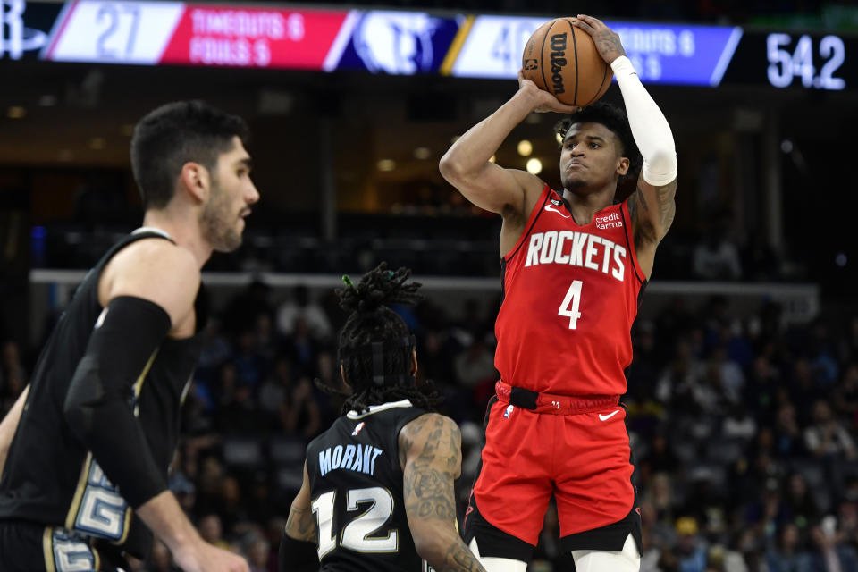 Houston Rockets guard Jalen Green (4) shoots over Memphis Grizzlies guard Ja Morant (12) during the first half of an NBA basketball game Friday, March 24, 2023, in Memphis, Tenn. (AP Photo/Brandon Dill)